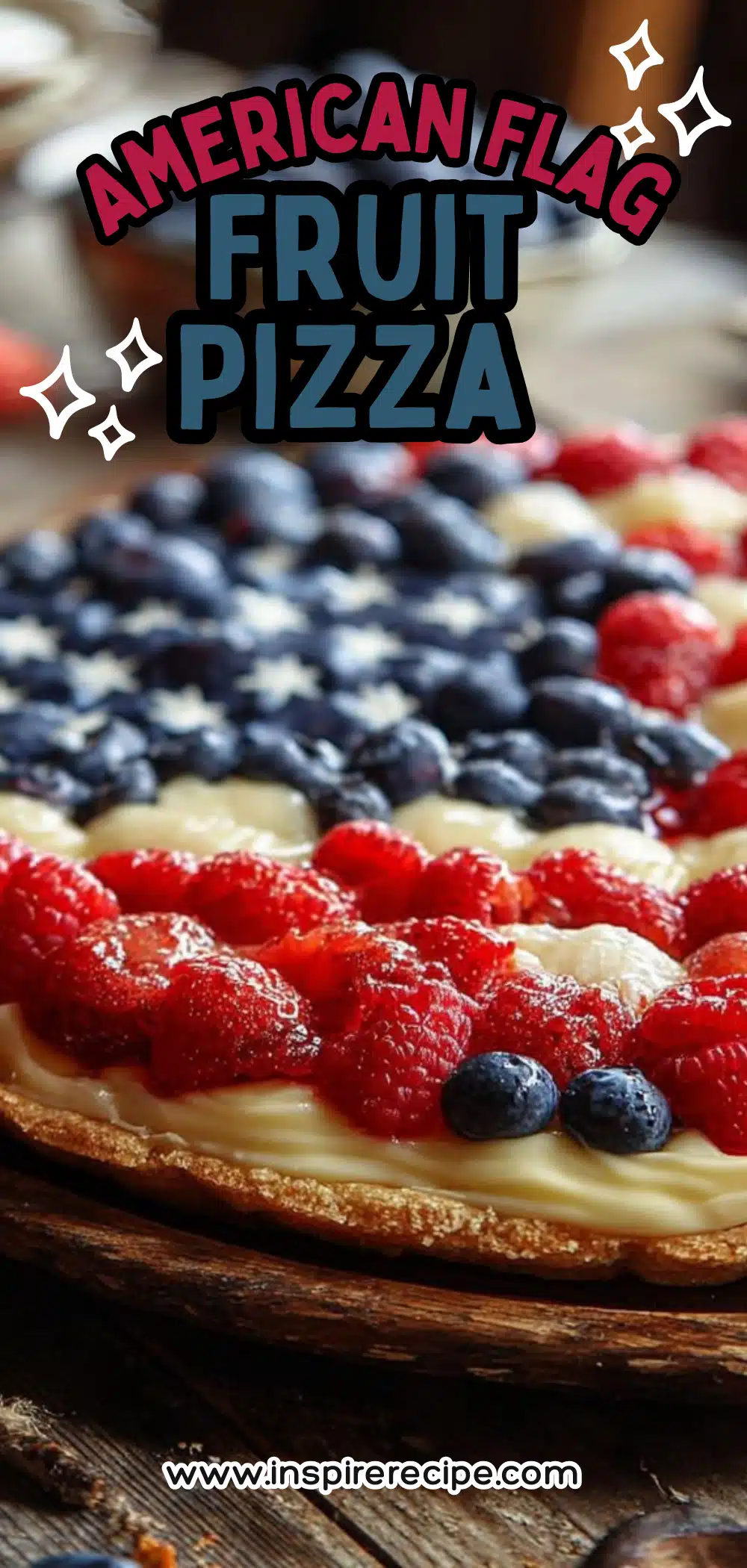 Round fruit pizza topped with raspberries and blueberries arranged in a flag design.