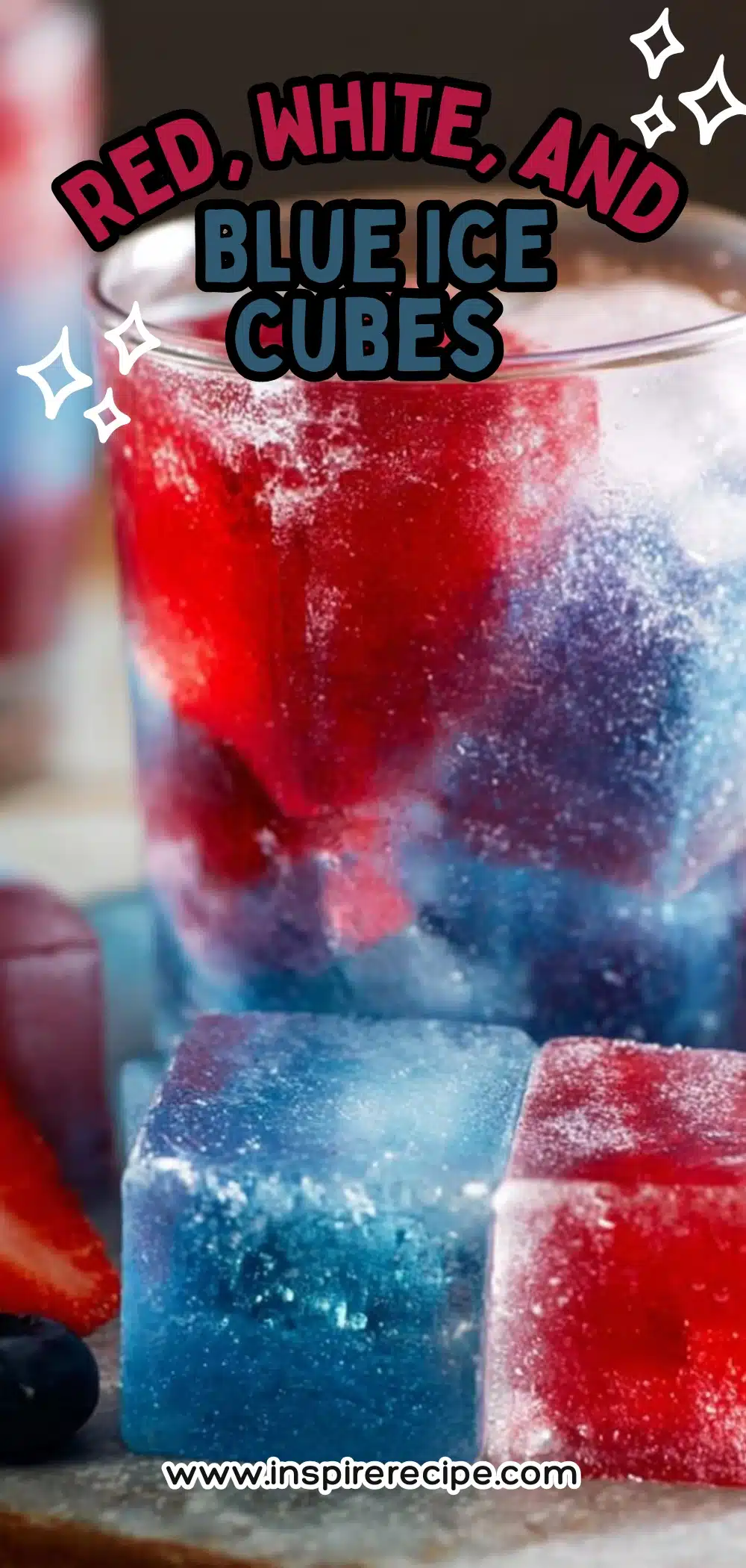 Red, white, and blue colored ice cubes in a glass with fresh berries.