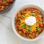 Instant Pot Cheesy Taco Beef & Rice dish, loaded with cheese and spices.