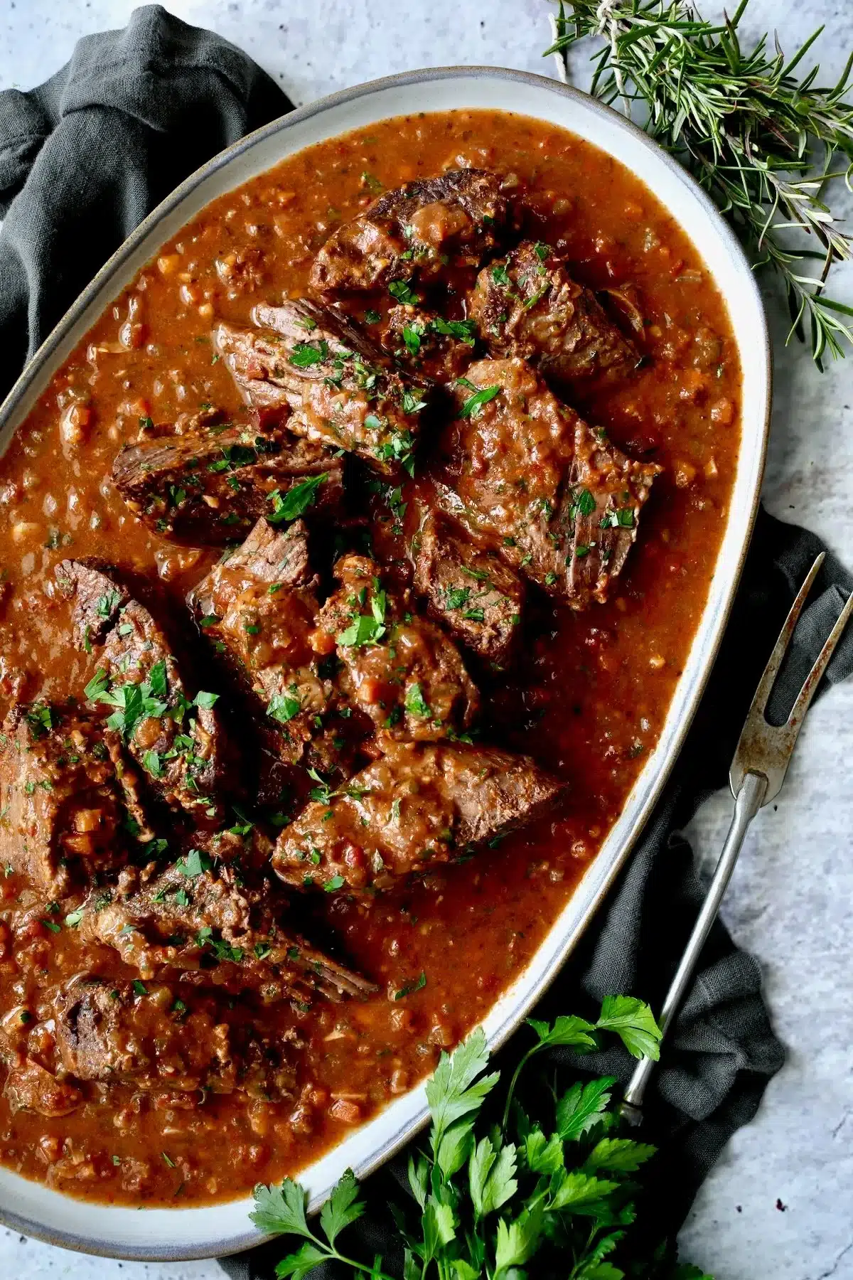 Italian Pot Roast Straccato served with Gorgonzola polenta on a plate