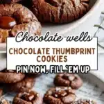 Delicious Chocolate Thumbprint Cookies with jam filling on a baking tray.