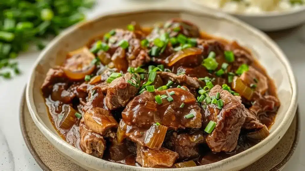Crock Pot French Onion Beef Tips served with herbs