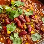 Bowl of Easy Crockpot Chili served with toppings