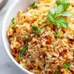 Deliciously spicy Chili Garlic Fried Rice served with fresh vegetables