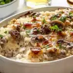 Creamy garlic mushroom hamburger rice bake in a serving dish