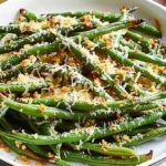 Crispy oven baked green beans topped with Parmesan cheese