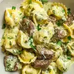 Delicious Garlic Steak Tortellini topped with Pesto Cream sauce