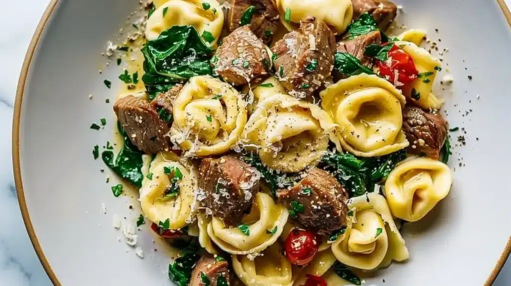 Delicious Garlic Steak Tortellini with Spinach served in a bowl