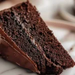 Delicious Matilda Chocolate Cake topped with chocolate ganache and sprinkles