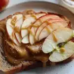 Delicious apple peanut butter toast topped with fresh apple slices.
