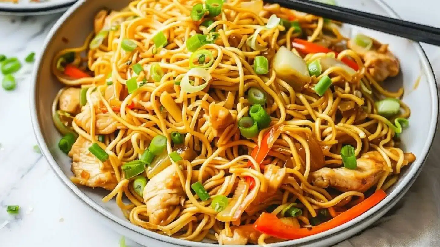 Plate of Chicken Chow Mein with vegetables and noodles