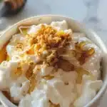 Delicious Greek yogurt honey bowl topped with nuts and fresh fruit