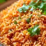 A bowl of perfectly cooked Instant Pot Mexican rice garnished with herbs