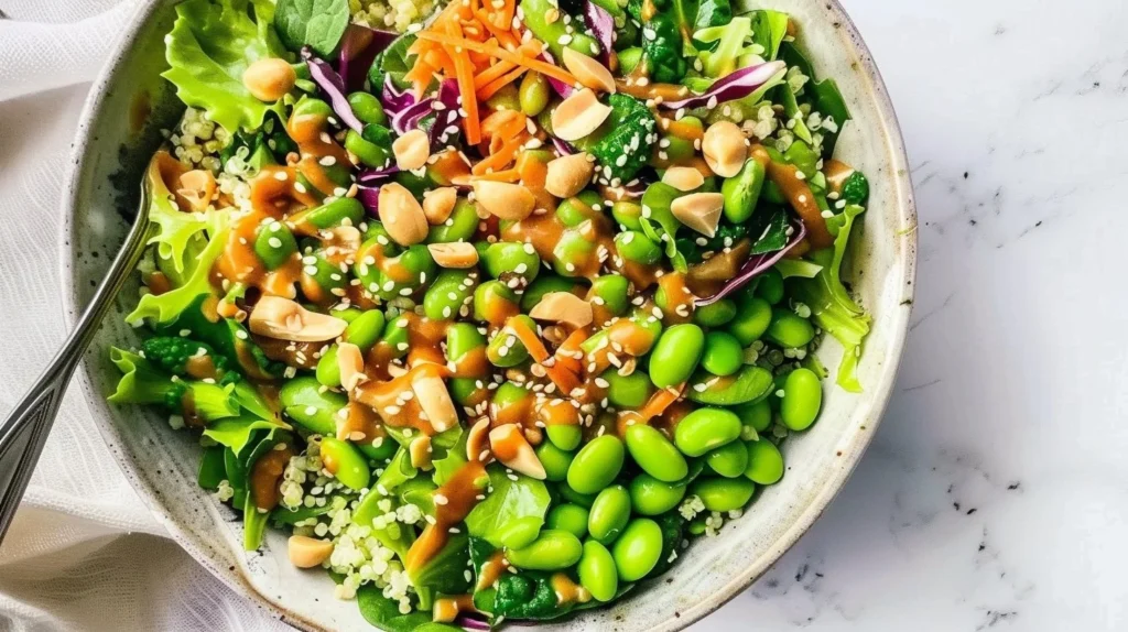 Vegan Edamame Salad topped with ginger-peanut dressing and colorful vegetables
